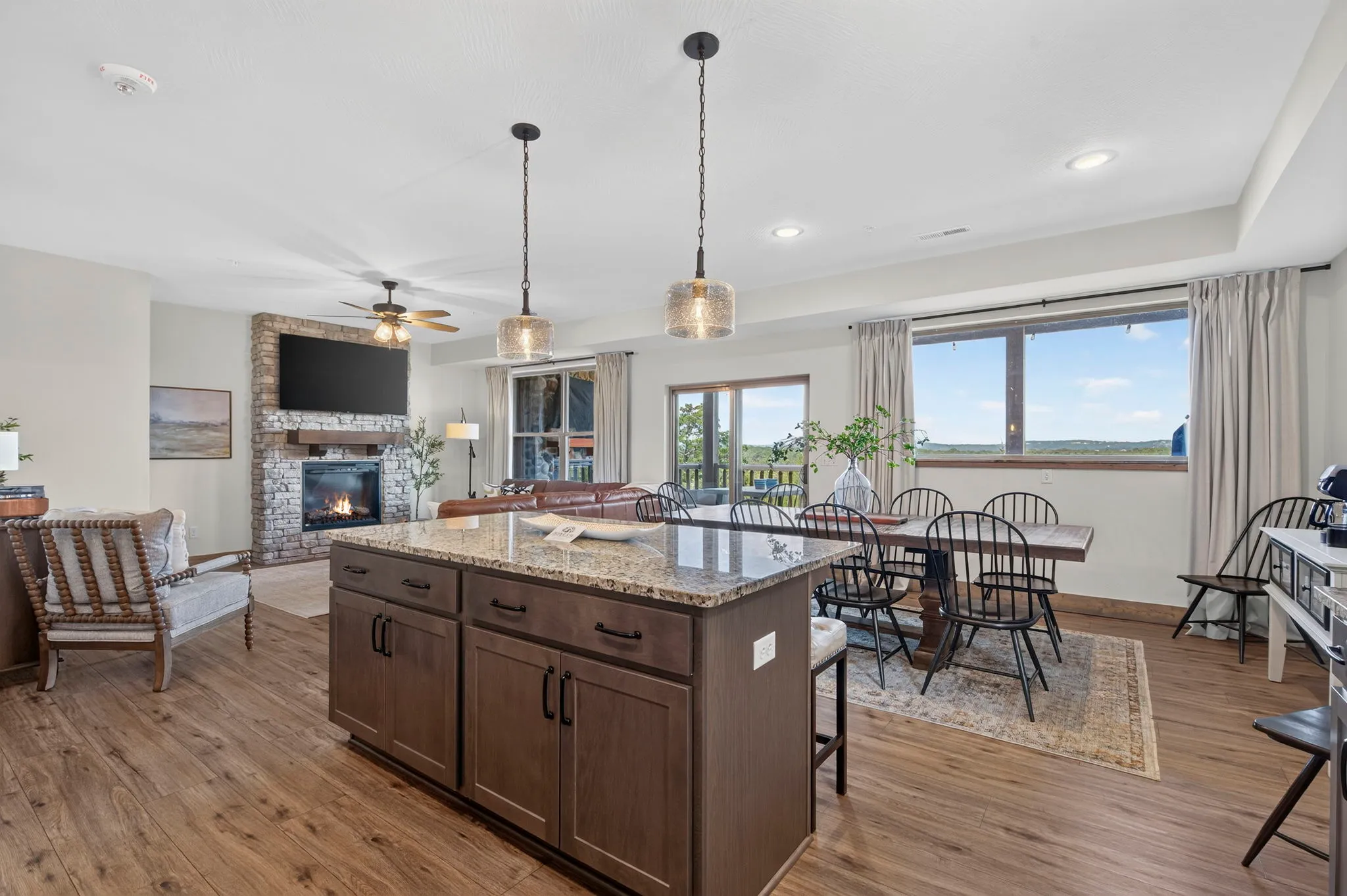 Kitchen opening to the living and dining spaces